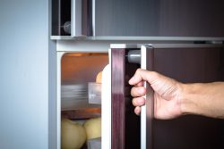 Abstract,Hand,A,Young,Man,Is,Opening,A,Refrigerator,Door